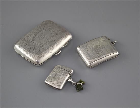 An Edwardian engraved silver cigarette case, Samuel M. Levi, Birmingham, 1905 and two similar vesta cases,